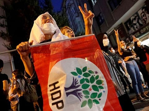 Supporters of pro-Kurdish Peoples Democratic Party (HDP) shout slogans during a protest.