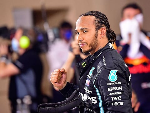 Formula One champion Lewis Hamilton will stay with Mercedes through the 2023 season after signing a two-year contract extension, the team said today.