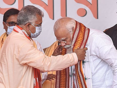 West Midnapore: Prime Minister Narendra Modi being welcomed by West Bengal BJP President Dilip Ghosh during an election campaign rally, ahead of State Assembly polls, at BNR Ground, Kharagpur in West Midnapore district, Saturday, March 20, 2021
