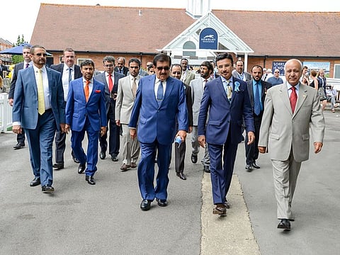 From left: Sheikh Hamdan Bin Rashid Al Maktoum, Deputy Ruler of Dubai and Minister of Finance, arrives at Newbury racecourse together with Sulaiman Hamid Al Mazroui, UAE Ambassador to the UK, and Mirza Al Sayegh, Director of Sheikh Hamdan's Office for the 35th Dubai International Arabian Races.