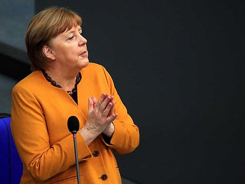 Angela Merkel, Germany's chancellor, gestures while speaking in the Bundestag in Berlin, Germany, on Wednesday, March 24, 2021. Merkel dropped plans for a five-day Easter shutdown amid massive criticism in the latest setback for Germany’s pandemic fight.