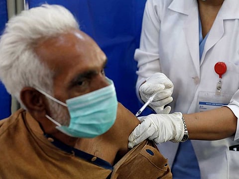 An elderly resident receives the first dose of the coronavirus disease (COVID-19) vaccine, as the government started vaccination for the general public, starting with elderly people, at a vaccination centre in Karachi, Pakistan March 10, 2021.