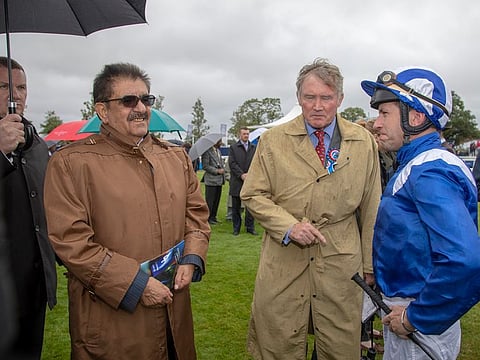 Sheikh Hamdan Bin Rashid Al Maktoum Deputy Ruler of Dubai and Minister of Finance with Richard Lancaster of Shadwell, during the Dubai International Arabian Races at Newbury Racecourse in England.