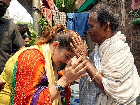 BJP candidate for Behala constituency Srabanti Chatterjee seeks blessings of the people during an election campaign, in Kolkata on Thursday, March 25, 2021.