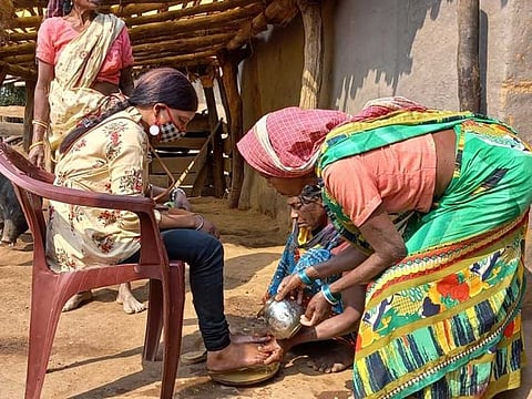 Raushani Kumari's mother washes her feet on her return home after nearly a decade.