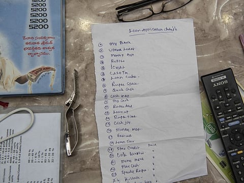 A list of online apps that a borrower used in Hyderabad, India, February 20, 2021. With techniques honed in China, a new breed of company in India offers expensive loans to people devastated by the pandemic. If they can’t repay, family and friends hear all about it.