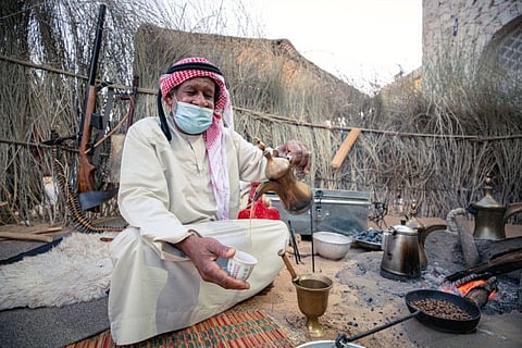 Coffee is the symbol of hospitality in Arabian heritage, and so it is with a cup of ‘gahwa’ (coffee) and dates that a veteran coffee maker is welcoming visitors to Sharjah Heritage Days, currently underway at the Heart of Sharjah historic district.