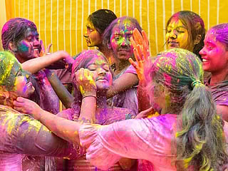 Photos: Indians gather for Holi celebrations as COVID-19 cases surge