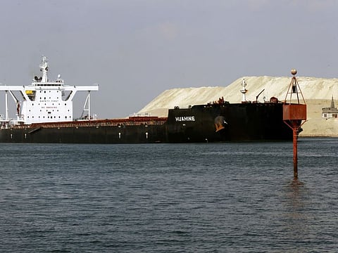 A ship is seen after sailing through Suez Canal as traffic resumes after a container ship that blocked the waterway was refloated, in Ismailia, Egypt, March 30, 2021.