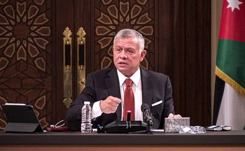 A handout picture released by the Jordanian Royal Palace on March 23, 2021 shows Jordanian King Abdullah II speaking during a meeting with the speaker and heads of a number of committees at the House of Representatives in the capital Amman.