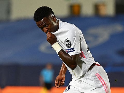 Real Madrid's Brazilian forward Vinicius Junior celebrates after scoring.