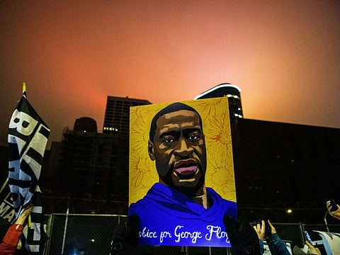 Demonstrators march through downtown on April 9, 2021 in Minneapolis, Minnesota. People demanding justice for George Floyd gathered tonight outside the Hennepin County Government Centre, where the trial of former Minneapolis police officer Derek Chauvin has been ongoing for the past two weeks.