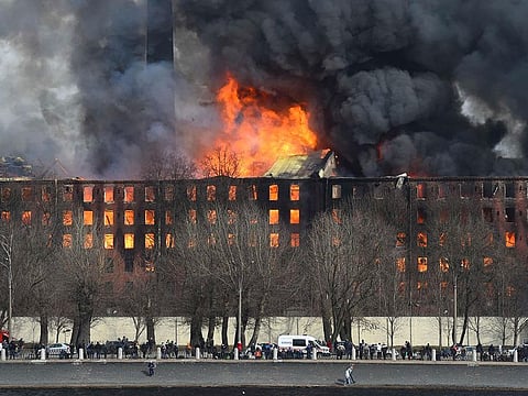 Smoke rises from a burning historic factory in Saint Petersburg.