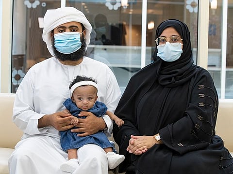 Emirati couple Fatema Omar and Ahmed Huseein Saleem with baby Latifa.