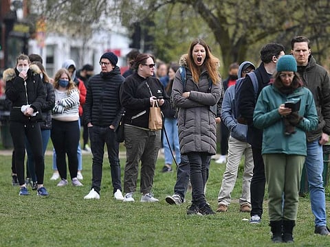 People queue to take a COVID-19 test at a mobile coronavirus testing centre on Clapham Common in south London