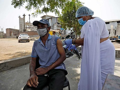 File picture: A rice mill worker receives a dose of COVISHIELD, a coronavirus disease (COVID-19) vaccine manufactured by Serum Institute of India, during a COVID-19 vaccination drive at Bavla village on the outskirts of Ahmedabad, India, April 13, 2021.