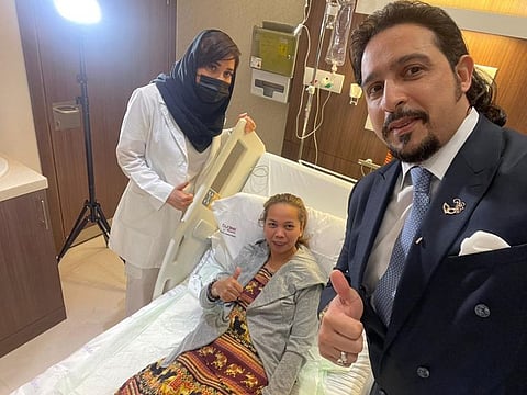 Plastic surgeon Dr Raed Farhat (right), his assistant and burn victim Maria Marissa at Burjeel Specialty Hospital Sharjah.