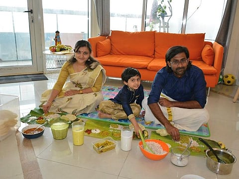 Gopikrishna Pillai, wife Ranjana and son Abhinav have 'sadhya' at their home in Dubai on Wednesday.