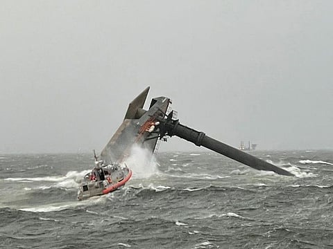 This US Coast Guard handout photo shows Coast Guard Station Grand Isle 45-foot Respone Boat-Medium boatcrew heading toward a capsized 175-foot commerical lift boat April 13, 2021 searching for people in the water 8 miles south of Grand Isle, Louisiana.