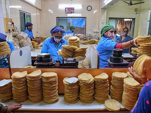 The staff of Shri Mahila Griha Udyog, the organisation that produces the famous Lijjat Papad, pack rolled papadums at one of the organisation's facilities in Mumbai.