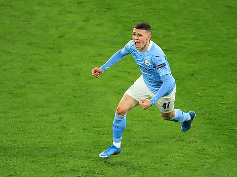 Manchester City's Phil Foden celebrates scoring their second goal.