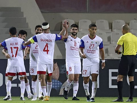 Sharjah players celebrate their goal during the AFC Champions League Group B match against Iraq's Air Force Club