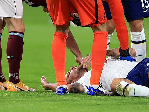 Tottenham's Toby Alderweireld is checked by fellow players after injuring his head during the English Premier League match between Burnley and Tottenham Hotspur.