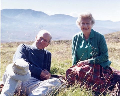 Handout image released by Buckingham Palace of a personal photograph of the Britain's Queen Elizabeth II and Prince Philip, the Duke of Edinburgh at the top of the Coyles of Muick, taken by The Countess of Wessex in 2003, obtained by Reuters on April 16, 2021.