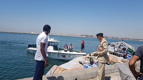 Lt Col Ali Al Naqb,i Director of Maritime Rescue Dept at Dubai Police, inspects the rescue operation.