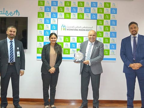 From left: Dr. Osman El Bakry, CEO and CMO holding the award, Remya Venugopalan, Director of Quality and Facility Planning Dr. Hany Gadallah, COO and Nidal Khalid AbduKuubbah Director of Nursing at the Award ceremony.