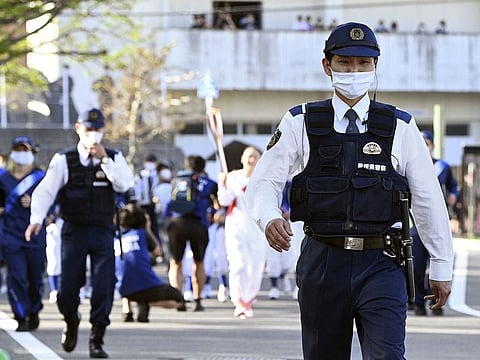 Police patrol the Tokyo 2020 Olympic Torch Relay