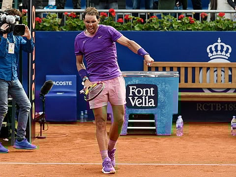 Rafael Nadal celebrates defeating Japan's Kei Nishikori during their Barcelona Open clash