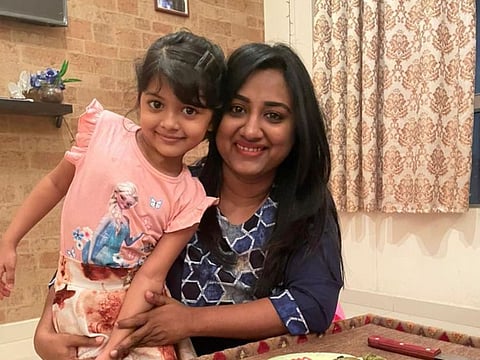 Celin Jacob with her four-year-old daughter Cheryl.
