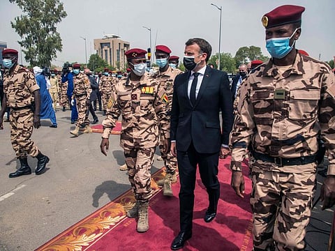 French President Emmanuel Macron and Mohammed Idriss Deby (centre, left) arrive for the state funeral for Chadian president Idriss Deby in N'Djamena, on April 23, 2021.