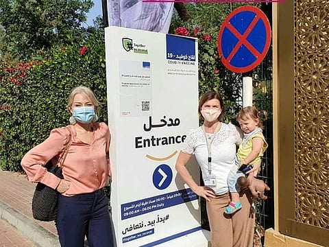 Lisa Johnson (left), principal, American Academy for Girls (AAG), and Shona Morgan, AAG operations director, with Fynn Morgan, during the second dose of their vaccination in Dubai recently.