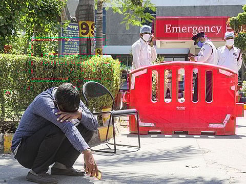 A man breaks down after loosing his relative at Jaipur Golden hospital, Rohini, New Delhi.