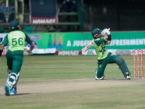 Pakistan batsman Mohammad Rizwan, right, plays a shot during the final cricket T20 match against Zimbabwe at Harare Sports Club, in Harare, Zimbabwe.