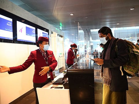 A passenger arrives to check-in at Hamad International Airport in Doha, Qatar.
