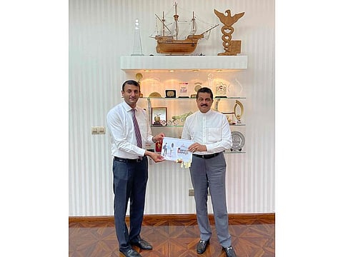 Dr Thumbay Moideen, Founder President along with Thumbay Group CHRO, Suraj Padmanabhan, launch the internship program booklet