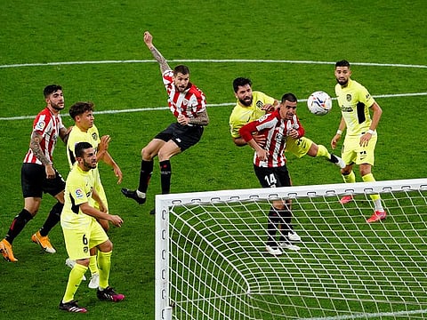 Athletic Bilbao's Inigo Martinez scores their second goal against Atletico Madrid.
