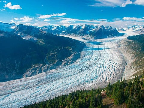 This September 2017 photo provided by researcher Brian Menounos shows the Klinaklini glacier in British Columbia, Canada. The glacier and the adjacent icefield has lost nearly 14.5 billion metric tons of snow and ice since 2000, with 9.8 billion metric tons of that since 2010, Menounos says. And the rate of loss accelerated over the last five years of the study.