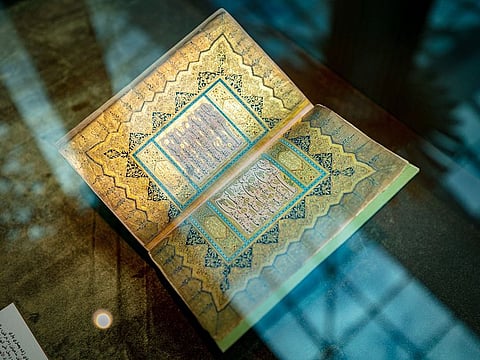 A copy of the Quran written by calligrapher Sherifa Zulaikha Khatami Al Saadi.