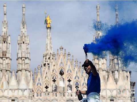 Inter Milan fans celebrate winning Serie A outside the Duomo di Milano.