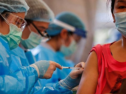 A woman from Klong Toey community receives coronavirus disease (COVID-19) vaccine, in Bangkok, Thailand, May 4, 2021.