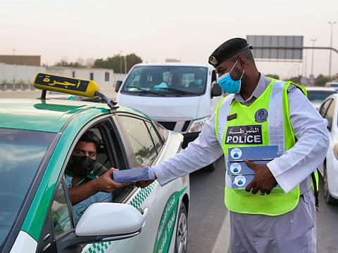Iftar packets being distributed by Ajman Police to motorists as part of a goodwill gesture.
