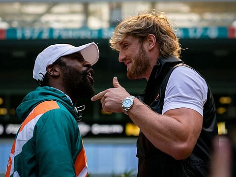 Floyd Mayweather and Logan Paul face-off during a press conference at Hard Rock Stadium, in Miami Gardens