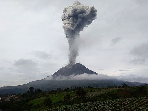 Mount Sinabung spews hot ash and smoke into the sky, seen from Karo, in North Sumatra on May 7, 2021.