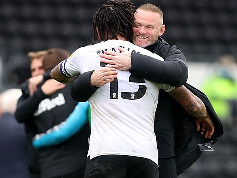 Derby County manager Wayne Rooney celebrates with Colin Kazim-Richards after the match with Sheffield Wednesday