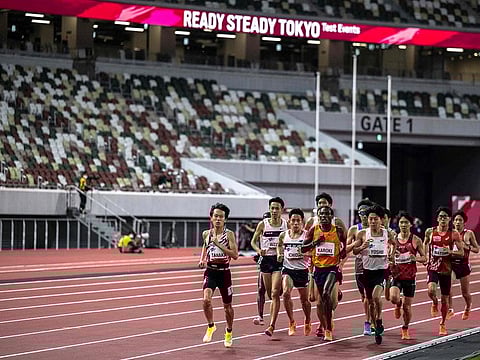 Athletes compete the men's 5,000m race during an athletics test event for the 2020 Tokyo Olympics at the National Stadium