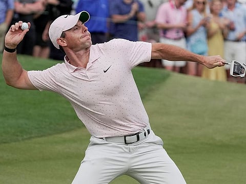 Rory McIlroy throws his ball into the crows after winning the Wells Fargo at Quail Hollow